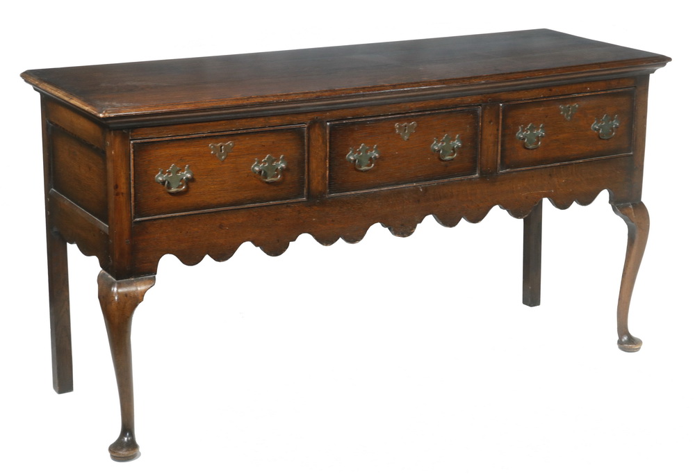 Appraisal: ENGLISH OAK THREE-DRAWER SERVER Country Chippendale style with molded overhanging