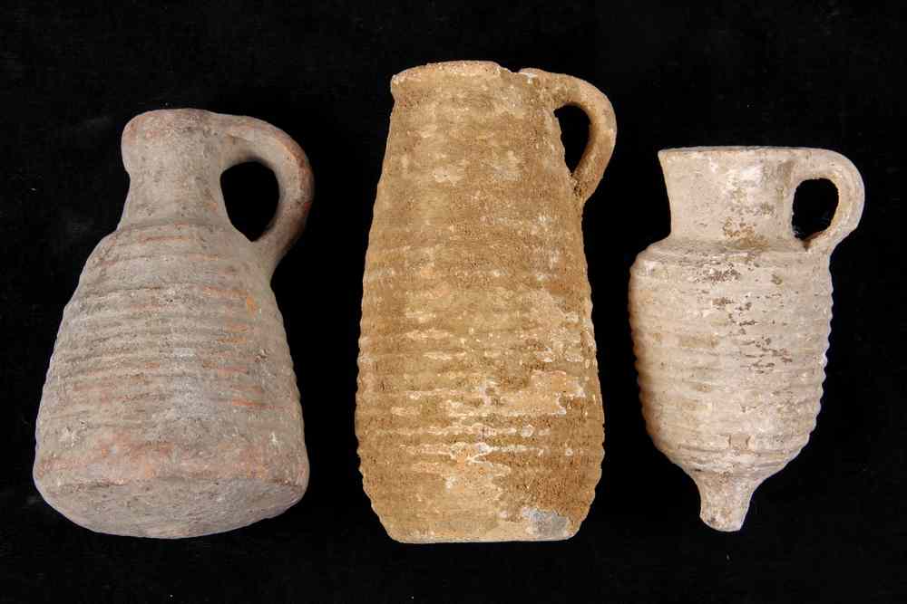 Appraisal: ANCIENT POTTERY VESSELS - Two Small Jugs with loop handles