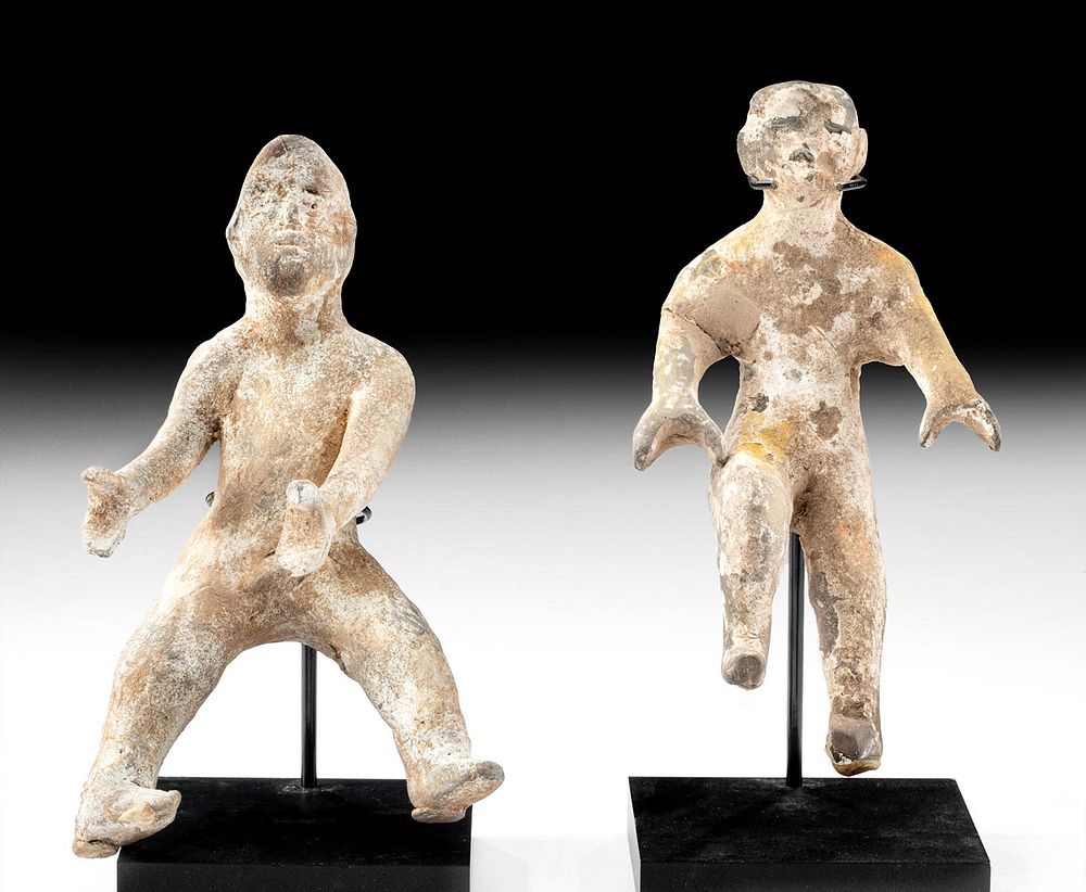 Appraisal: Pair of Chinese Han Dynasty Pottery Acrobats East Asia China