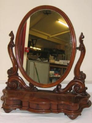 Appraisal: A VICTORIAN MAHOGANY TOILET MIRROR the oval plate raised on