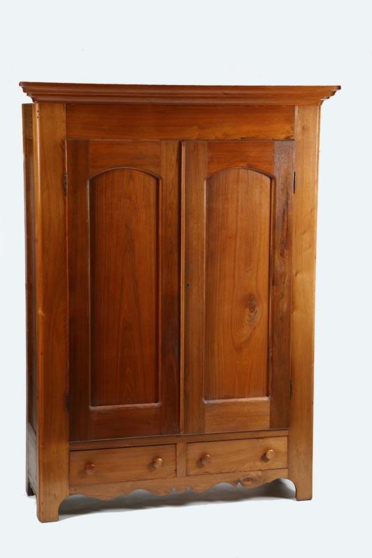 Appraisal: WARDROBE One piece walnut having two paneled and arched doors