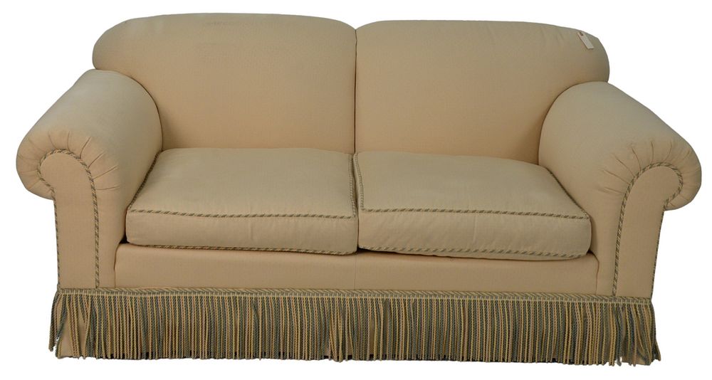 Appraisal: Custom Upholstered Loveseat having two cushions with fringe x x