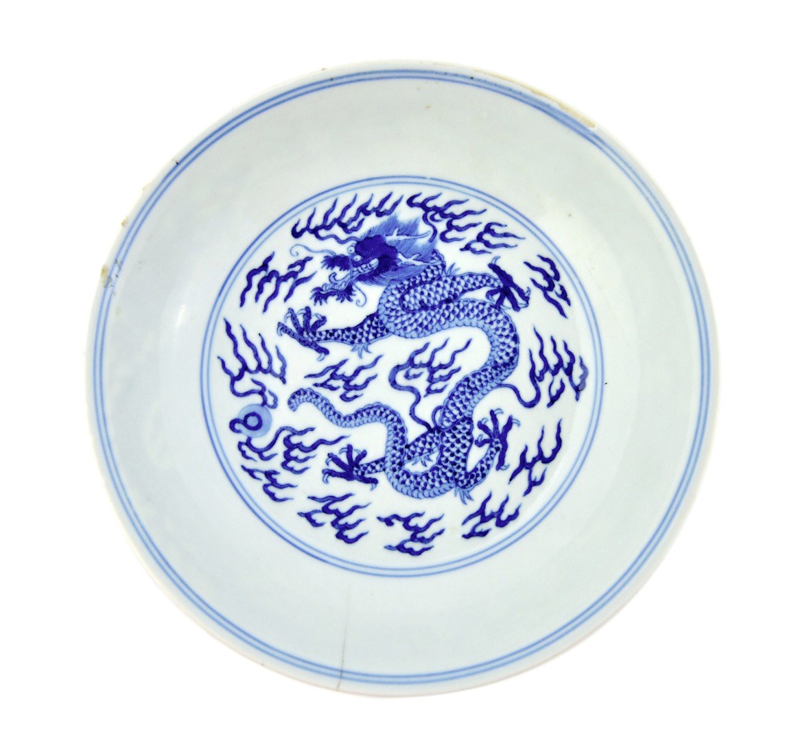 Appraisal: A Chinese blue and white dragon' saucer dish blue Jiaqing