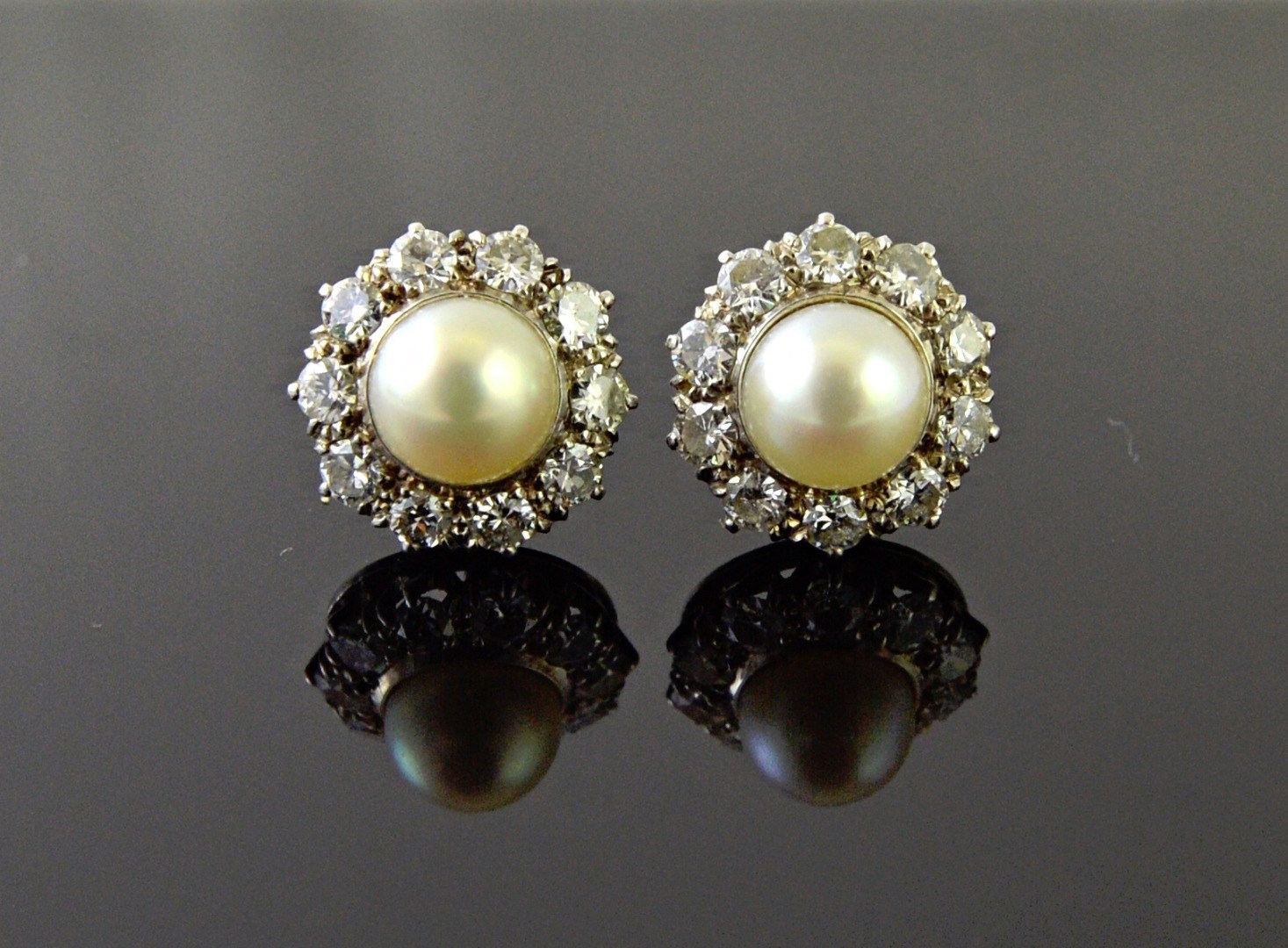 Appraisal: A pair of white gold diamond and cultured pearl set