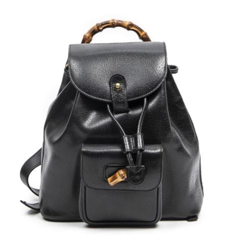 Appraisal: Gucci drawstring backpack in black grained leather with gold-tone hardware