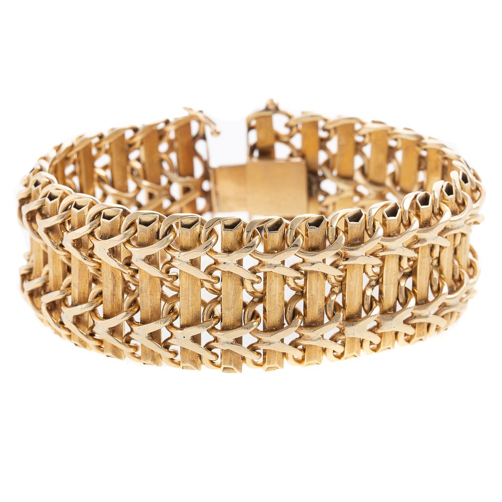 Appraisal: A Textured Wide Link Bracelet in K K yellow gold