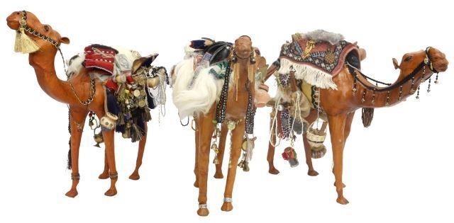 Appraisal: lot of Leather-clad camel figures all having elaborate bridles adorned