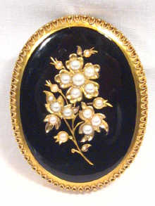 Appraisal: A Victorian high carat gold onyx and pearl flower brooch