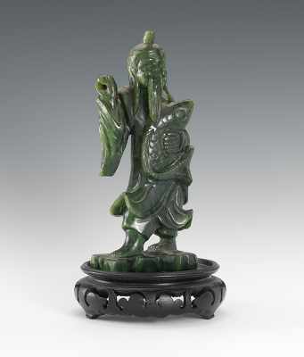 Appraisal: A Spinach Jade Figure of a Man The man is