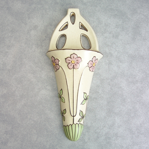 Appraisal: ROSEVILLE Ceramic Design Persian-type wall pocket decorated with pink flowers