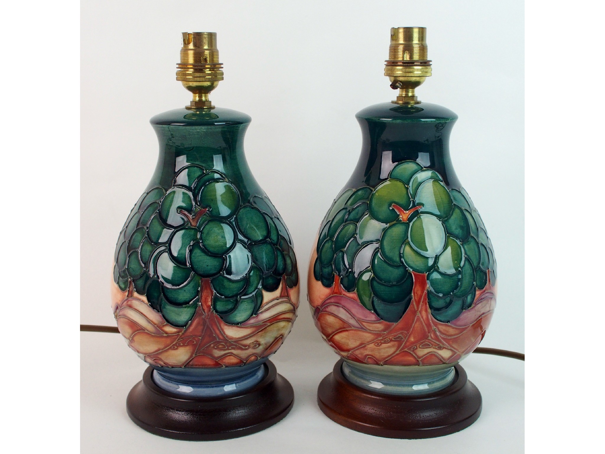 Appraisal: Two Moorcroft pottery Mamoura lampsbases designed by Sally Tuffin the