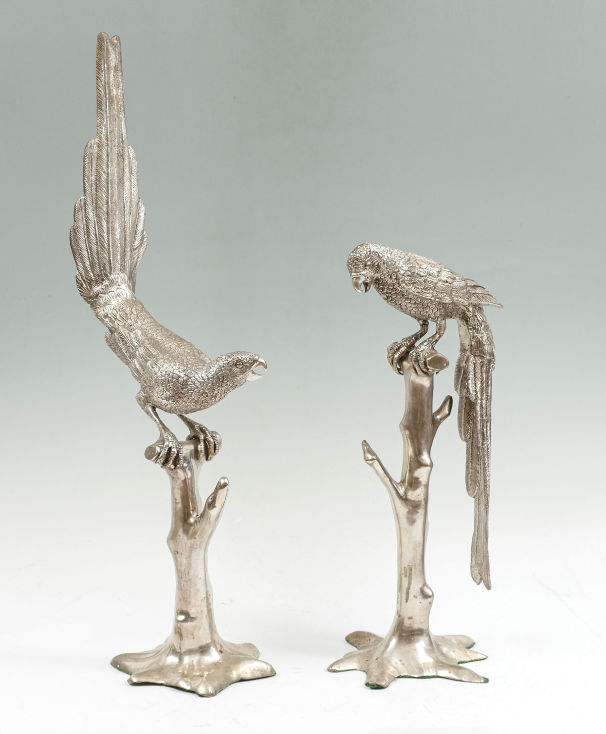 Appraisal: PR SILVERED BRONZE PARROT SCULPTURES Silvered cast bronze life sized