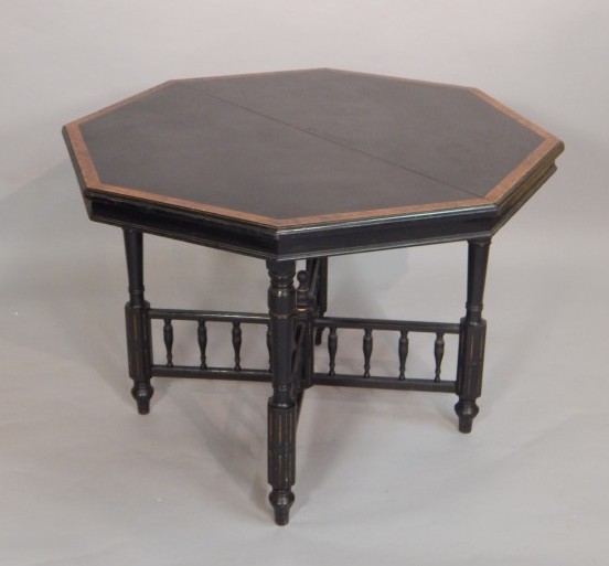 Appraisal: A Victorian ebonised and yew banded Aesthetic style table the