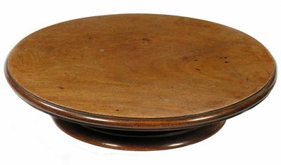 Appraisal: A mahogany lazy susan the revolving top with a moulded