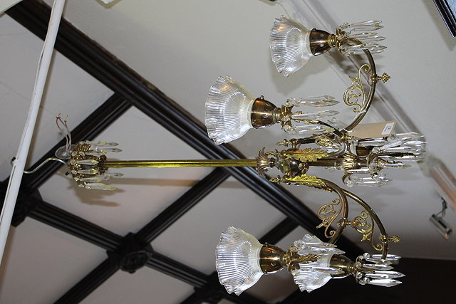 Appraisal: AN EDWARDIAN GILT METAL FOUR BRANCH CHANDELIER with opaque glass