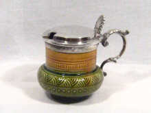 Appraisal: A Royal Doulton mustard pot with silver plated lid