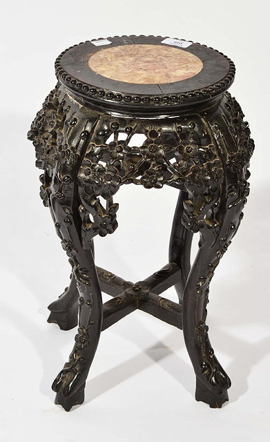 Appraisal: A CHINESE HARDWOOD LOW URN STAND with inset circular marble