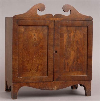 Appraisal: LATE FEDERAL MAHOGANY SPECIMEN CABINET With swan's neck crest the