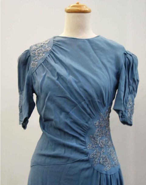 Appraisal: s dinner dress in pale blue wool crepe with silver