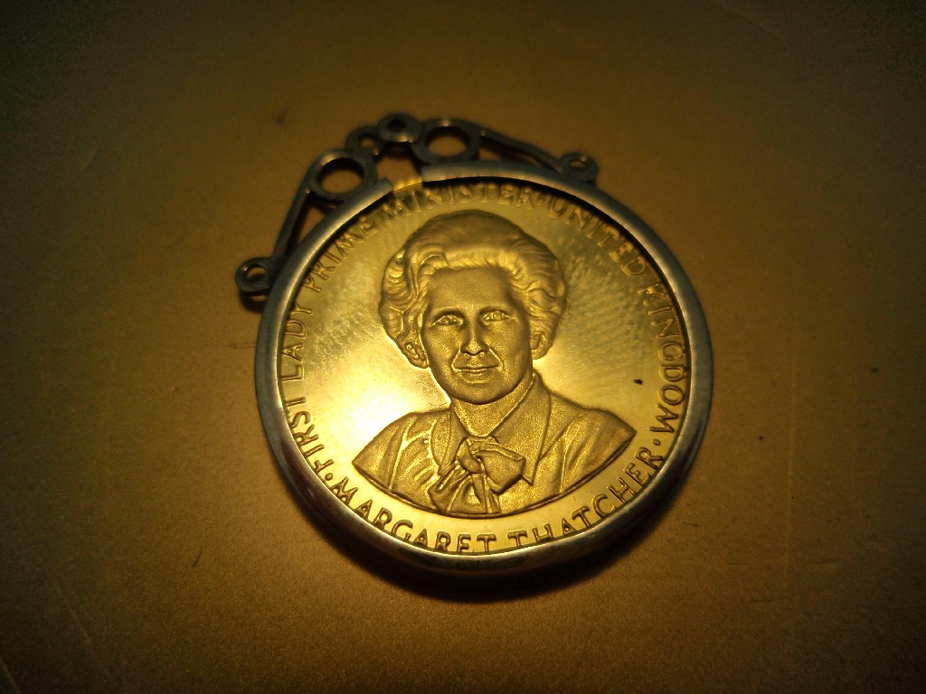 Appraisal: A Margaret Thatcher commemorative coin set as a pendant