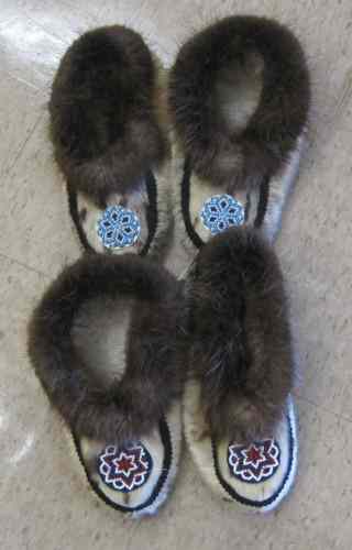 Appraisal: TWO PAIR INUIT HAND MADE MOCCASINS beaded decoration having leather