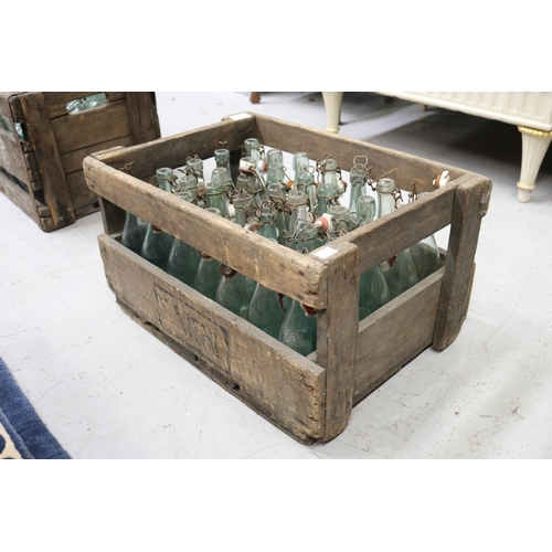 Appraisal: Vintage French wooden crate with glass bottles