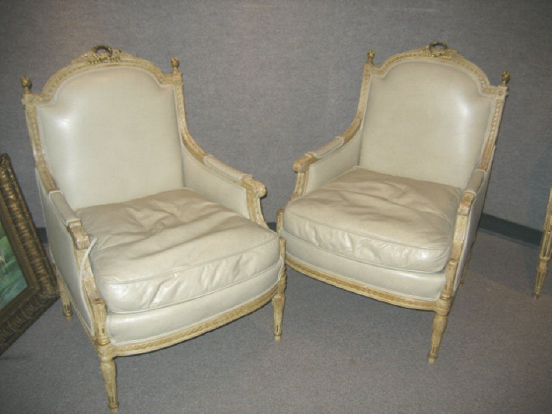 Appraisal: PAIR LOUIS XVI STYLE LEATHER UPHOLSTERED BERGERES Having arched backs