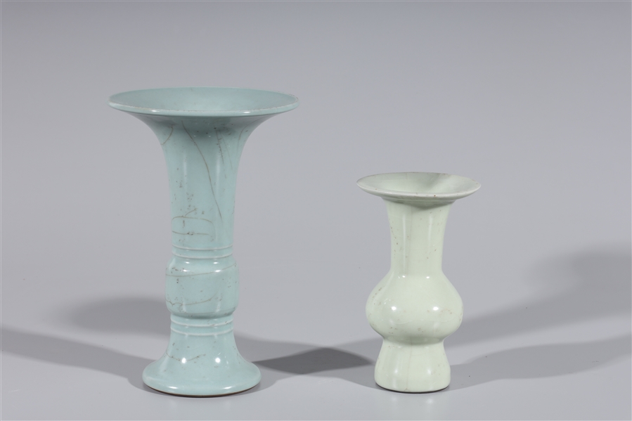 Appraisal: Two Chinese celadon wine vessel vases gu shape each with