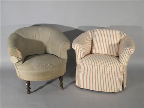 Appraisal: PAIR VICTORIAN UPHOLSTERED ARM CHAIRS The upholstered frame raised on