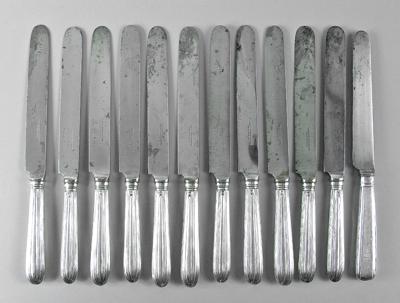 Appraisal: Twelve English silver knives eleven with rounded reeded handles James