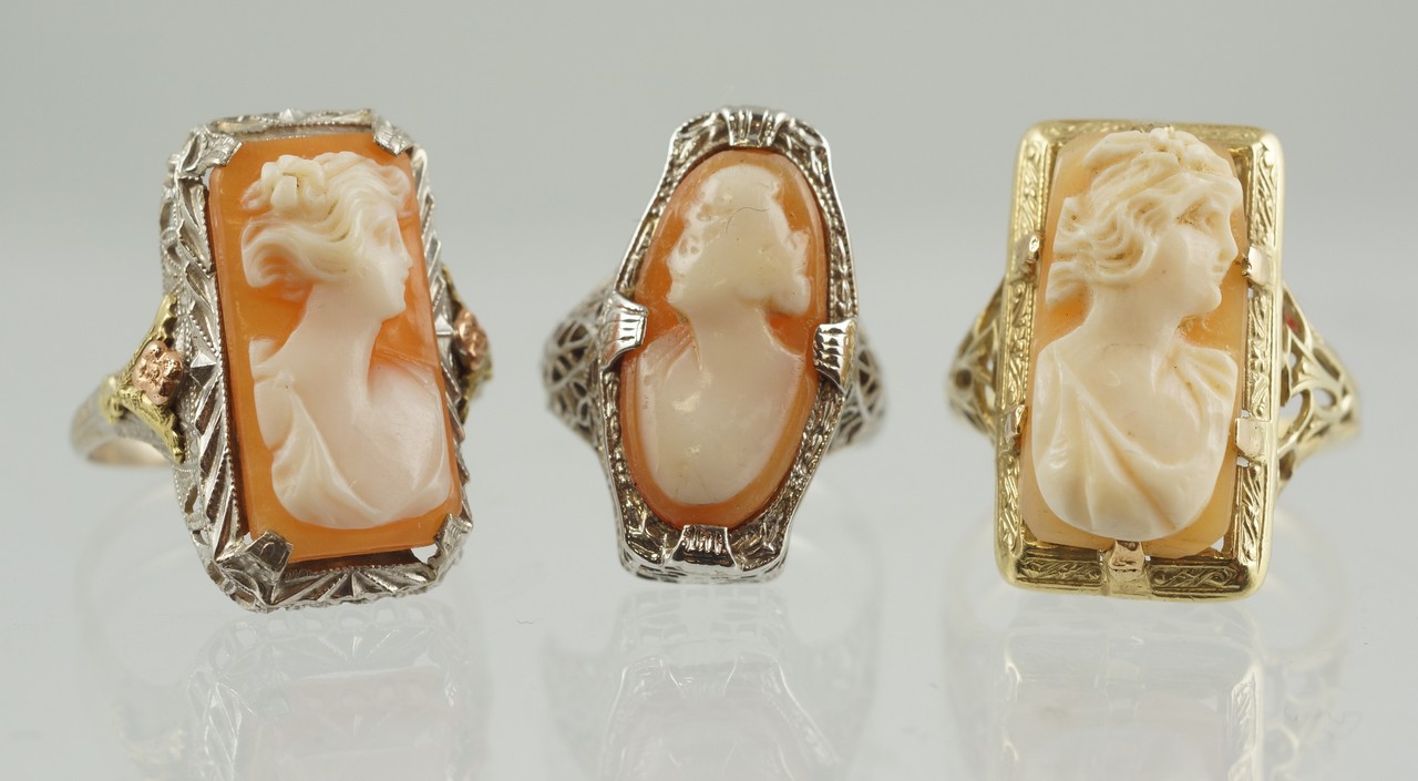 Appraisal: K WG K WG carved cameo rings filigree settings