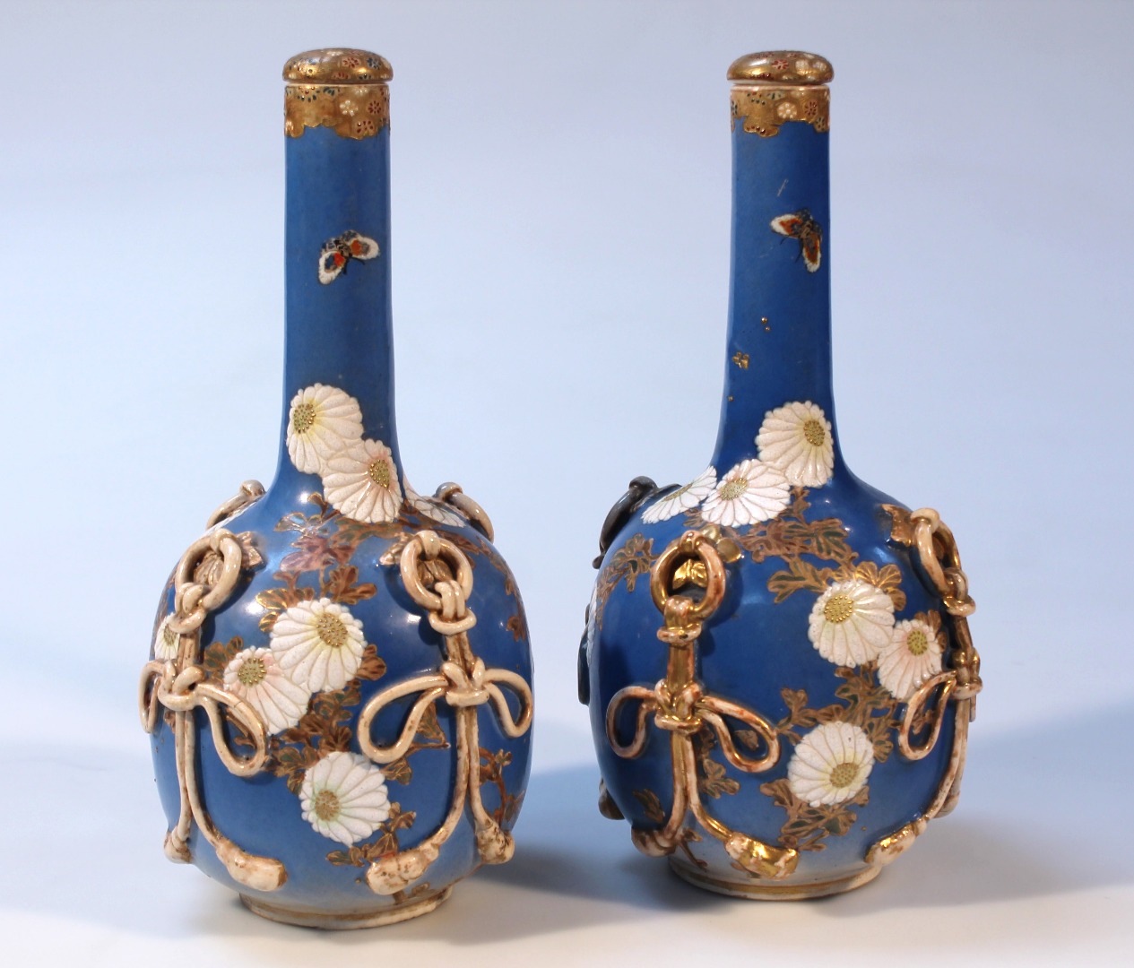 Appraisal: A pair of thC Japanese earthenware bottle vases and stoppers