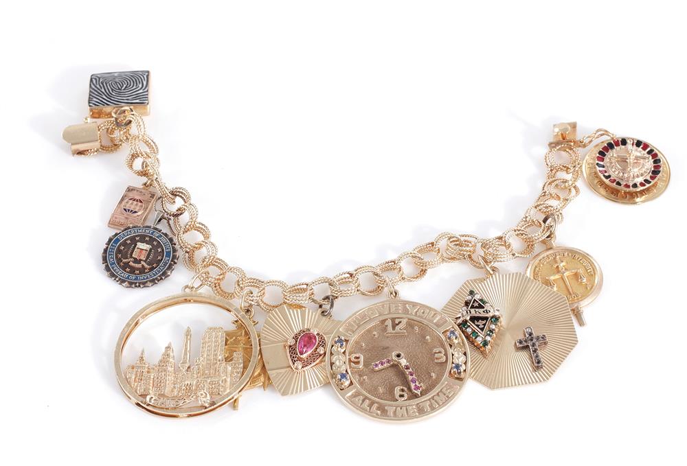 Appraisal: Gemstone and gold charm bracelet with FBI charms nine K