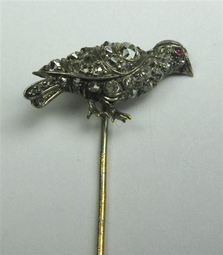 Appraisal: A ruby and diamond set stickpin the terminal modelled as