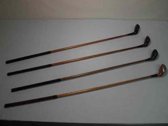 Appraisal: Fancy face wood shaft golf clubs total Includes an R