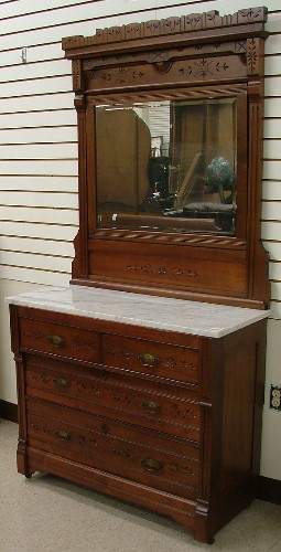 Appraisal: VICTORIAN WALNUT BED AND DRESSER Eastlake design American c The