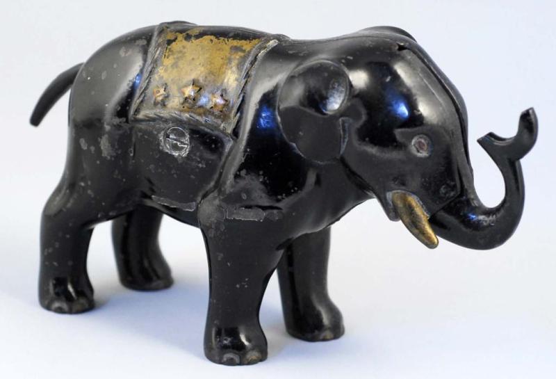 Appraisal: Cast Iron Elephant with Trunk Mechanical Bank Description Manufactured by