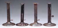 Appraisal: FOUR SIMILAR HOGSCRAPER CANDLESTICKS Each having thumb ejectors one with