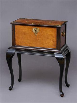 Appraisal: ANGLO INDIAN BRASS-MOUNTED HARDWOOD CHEST ON STAND The hinged lid