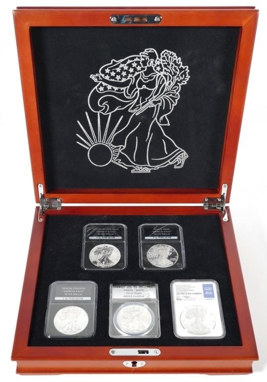 Appraisal: Five slabbed versions of the American Eagle silver dollar including