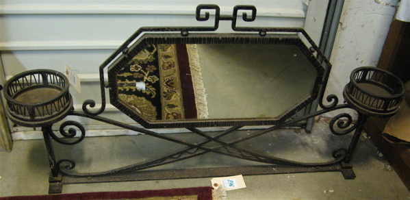 Appraisal: DOUBLE SIDED FER FORGE MIRROR French c 's the elongated