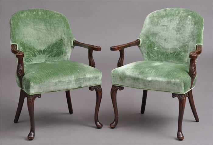 Appraisal: PAIR OF GEORGE II-STYLE CARVED MAHOGANY ARMCHAIRS Each with shaped