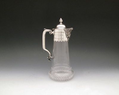 Appraisal: A Regimental presentation electroplated claret jug tapering circular form cut