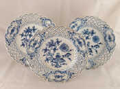 Appraisal: Three Meissen ceramic blue and white display plates with pierced