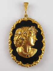 Appraisal: A carat gold onyx and diamond set cameo pendant approx