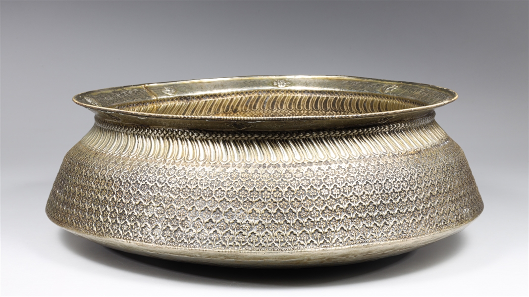 Appraisal: Large Nepalese white metal repose circular form basin exterior body