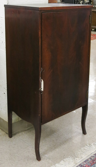 Appraisal: MAHOGANY MUSIC CABINET American c a plain single door cabinet