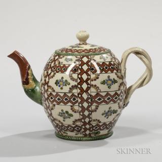 Appraisal: Chintz Pattern Cream-colored Earthenware Teapot and Cover England c globular