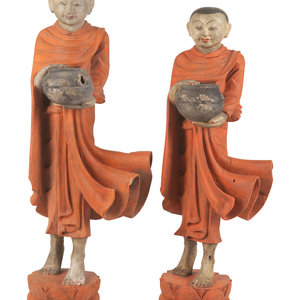 Appraisal: Two Burmese Polychrome Painted Carved Wood Figures depicting monks each