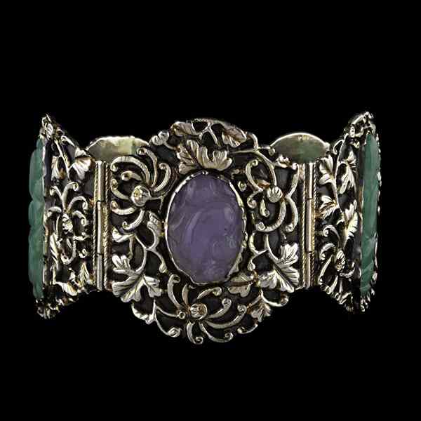 Appraisal: Silver Bangle with Green and Lavender Jade Chinese sterling silver